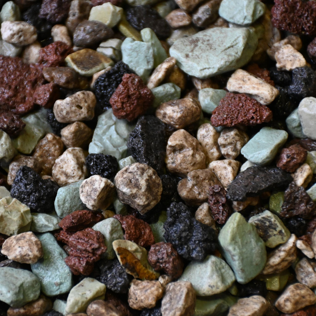 Mixed mineral substrate of green, red and pale stones